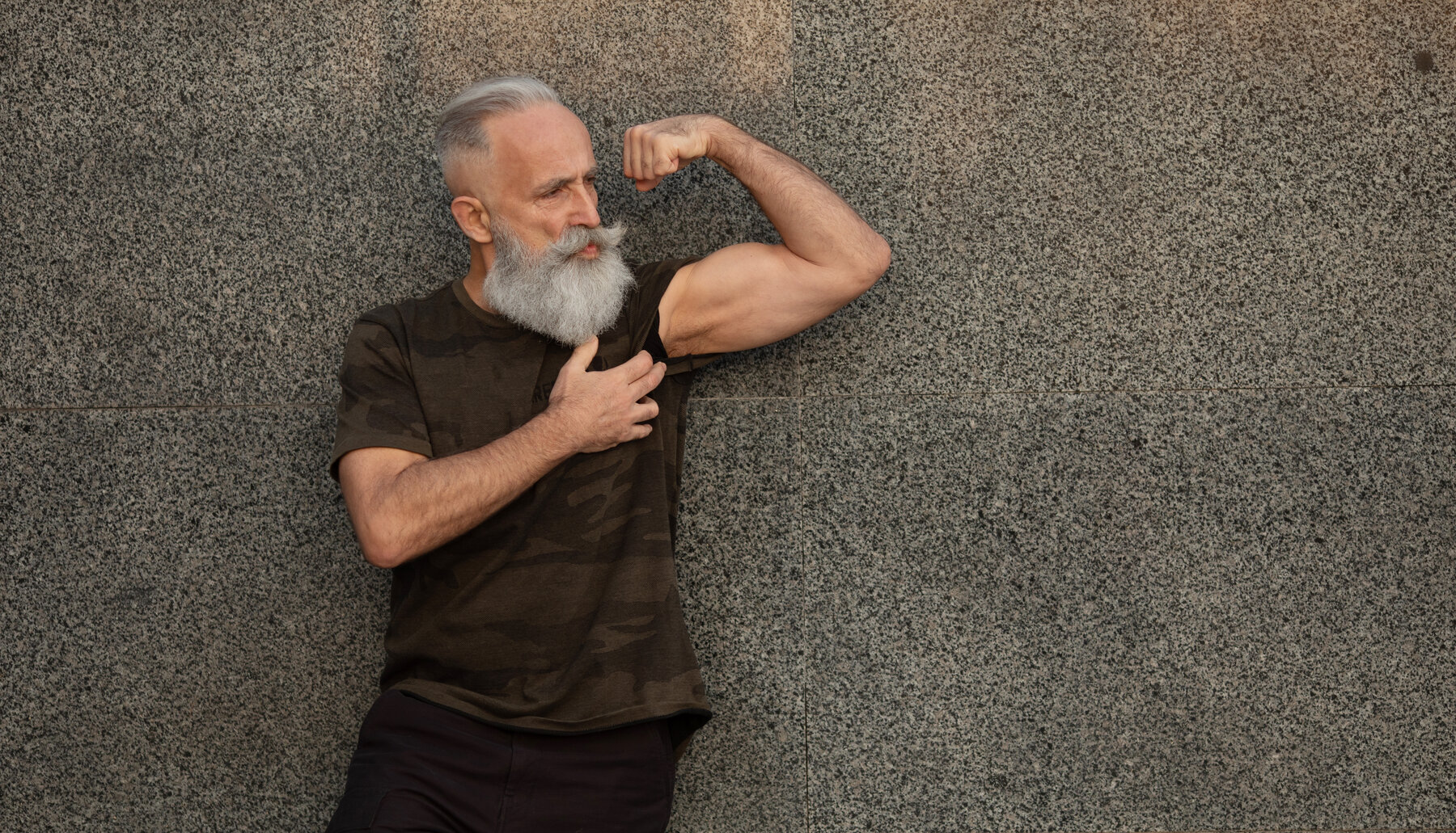 An E Studio client showing the strength built through years of slow-motion training.